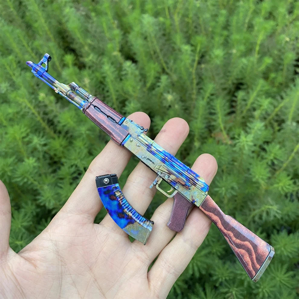AK-47 Case Hardened replica in a hand with the magazine detached