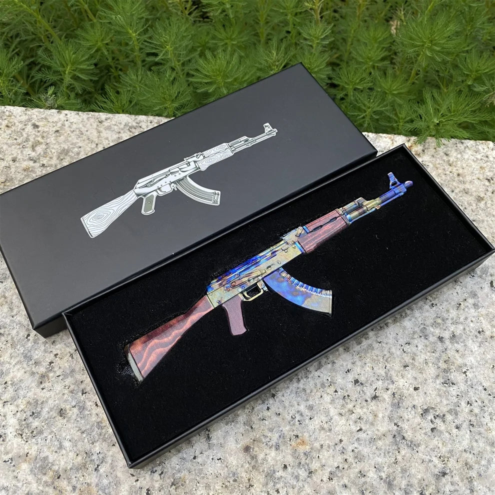 AK-47 Case Hardened miniature lying in its open black gift box