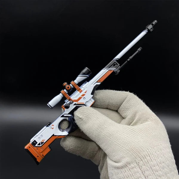 AWP Asiimov miniature held in a gloved hand, showing its 1:5 size