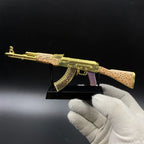 AK-47 Gold Arabesque replica on its black display stand