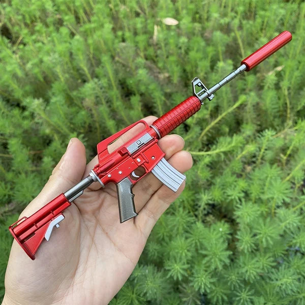 M4A1-S Hot Rod miniature held in a hand, showing its 1:5 size