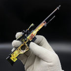 AWP Dragon Lore miniature held in a gloved hand, showing its size
